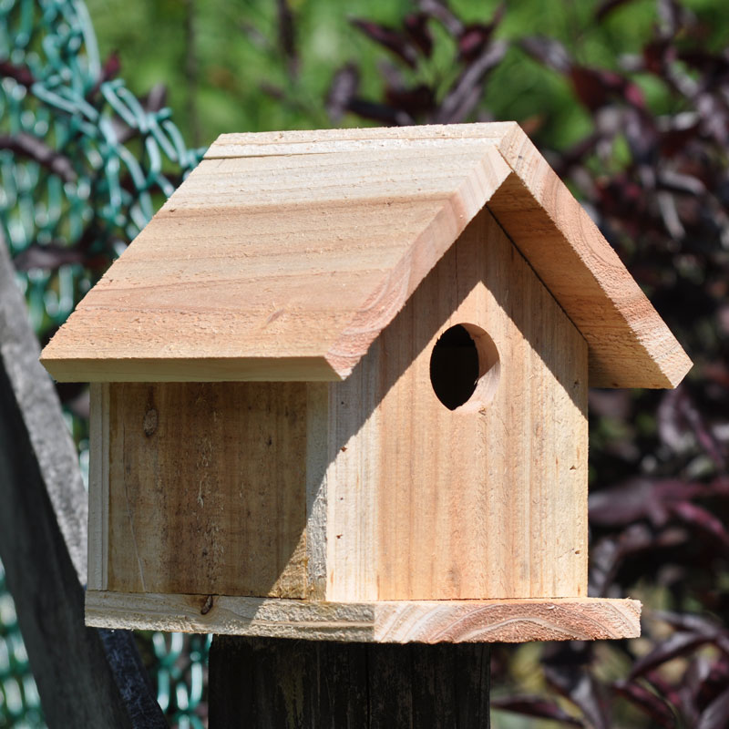 Handcrafted medium wooden birdhouse made by 12-year-old Timmy