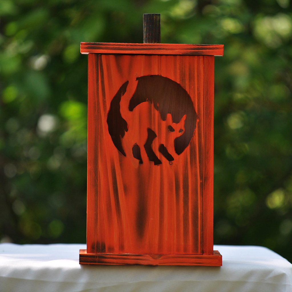 Handcrafted large wooden birdhouse made by 12-year-old Timmy